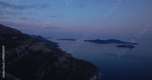 Coastal Islands Aerial At Dusk With Pastel Sky And Calm Sea, Distant Archipelago And Sweeping Shoreline Cliffs, Cinematic Drone Glide Capturing Tranquil Evening Mood,
