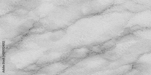 An abstract closeup of a bright white stone surface and frozen snow reveals a textured marble pattern reflecting a cold winter sky