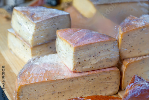 Different types of cheese displayed at a street market