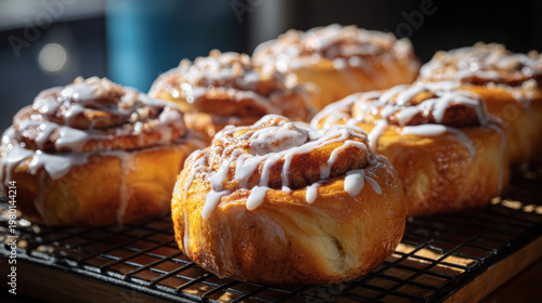 Warm cinnamon rolls freshly baked and drizzled with icing sugar. 