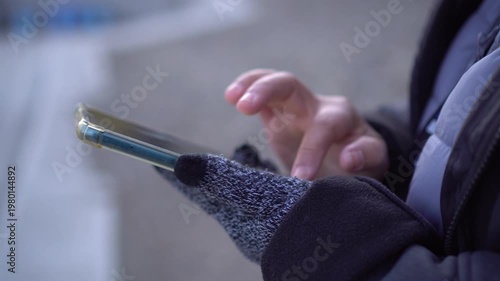 Using mobile smartphone check flight schedule wait in airport terminal