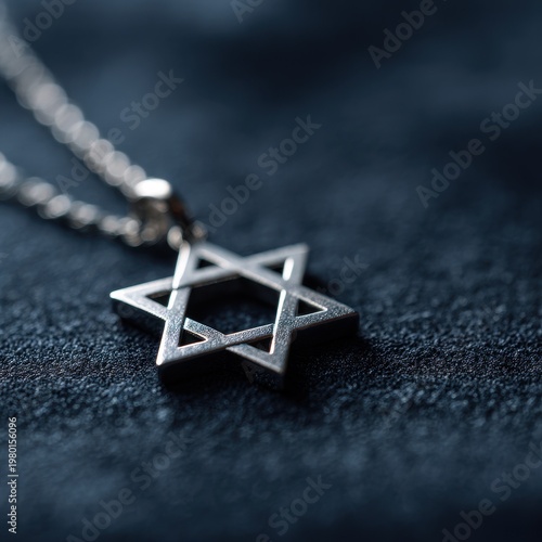 Elegant Star of David symbol on metal, shallow depth of field, dramatic lighting