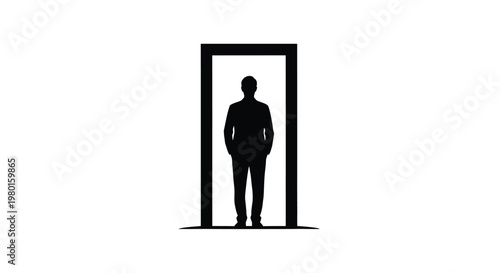 A man stands confidently in a doorway with his hands in his pockets looking forward