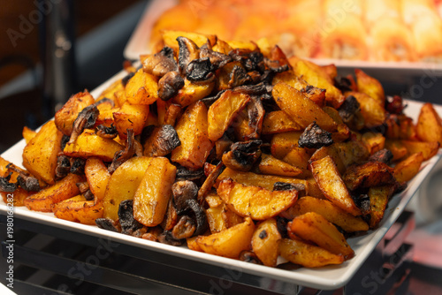 Wallpaper Mural Close-up of delicious roasted potato wedges with mushrooms Torontodigital.ca