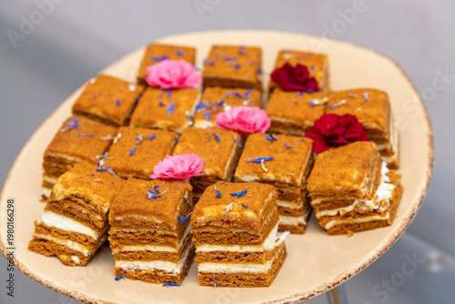 Wallpaper Mural Layered honey cake squares with cream on a plate Torontodigital.ca