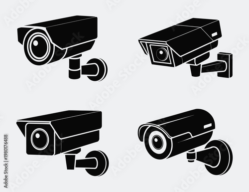 Set of four black security surveillance cameras