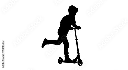 A young boy joyfully rides a scooter in stark silhouette