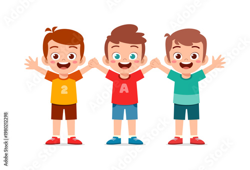 Three happy smiling young boys standing together with arms raised in a cheerful playful mood