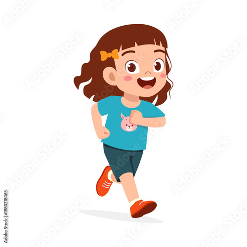 Young happy girl with brown hair running and smiling cheerfully wearing blue shirt with bunny graphic