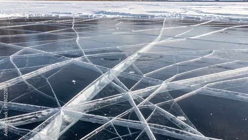 Frozen lake with cracked ice patterns