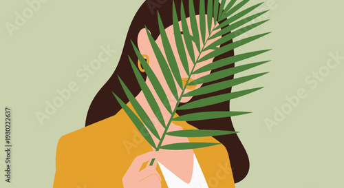 A woman partially obscured by large tropical leaves creating a sense of mystery and natural beauty