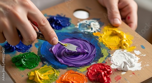 Artist Mixing Colorful Oil Paints on Wooden Palette with Spatula