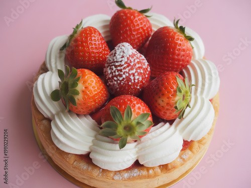 Delicious strawberries topped with whipped cream in a decorative dish