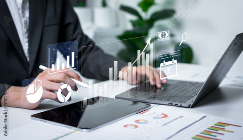 Fotografie Businessman analyzing financial charts with business intelligence concept, banking analytics, market canvassing, data driven insights and corporate finance strategy