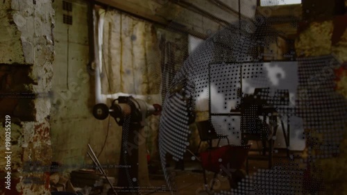 Digital dot-grid overlay sweeping from right edge, oscillating and pixelating workshop to show scan