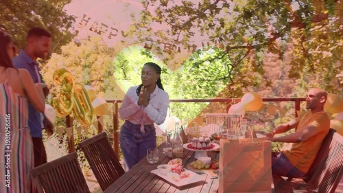 Man approaching left revealing banner, four friends gathering around birthday cake, clapping