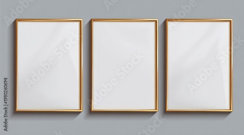 Three golden rectangular frames with blank white insides, shadows on gray
