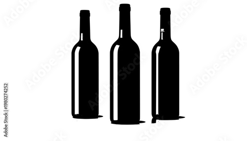 Three wine bottles standing upright on a white surface