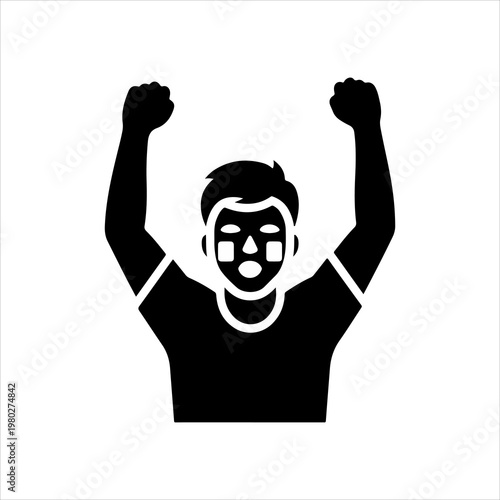 Enthusiastic sports fan with face paint cheering with arms raised in victory.