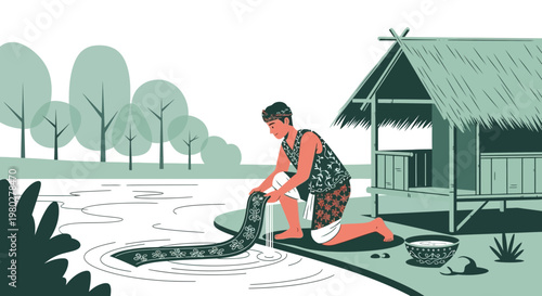 Man washing traditional fabric by a river near a hut in a tropical landscape