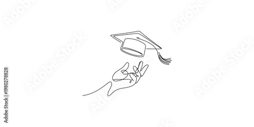 Graduation cap tossed in air by hand in celebratory gesture of academic achievement celebration commencement