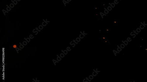 Wallpaper Mural Abstract glowing orange light sparks against dark background Torontodigital.ca