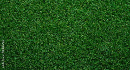 Synthetic turf with vibrant green color and lush dense grass texture background