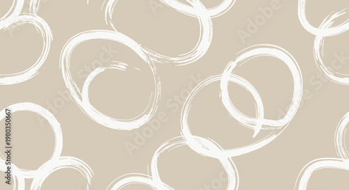 Abstract brush strokes forming circles and swirls.