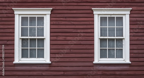 Vintage wood siding featuring double windows highlighted by white borders in studio light copy space