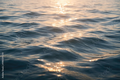 Tranquil water surface texture with gentle waves and light reflections