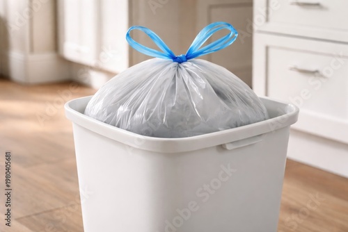 White waste bin holding a f...