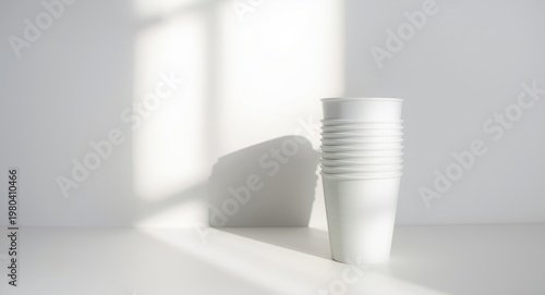 vertical stack of cups with...