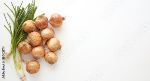 Fresh shallot lying on crisp white flat background