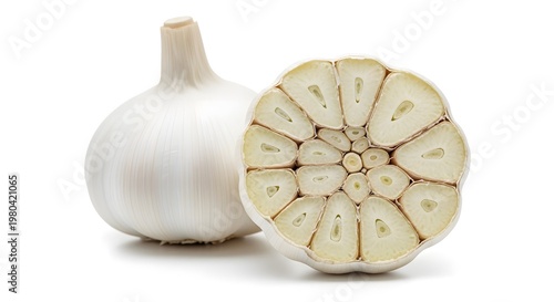 Fresh Whole Garlic Bulb and Sliced Cross-Section Revealing Cloves on White Background