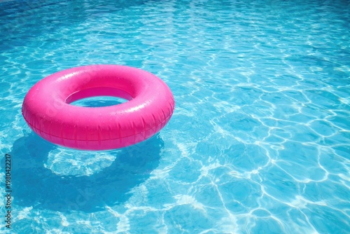 A vibrant pink flotation ri...