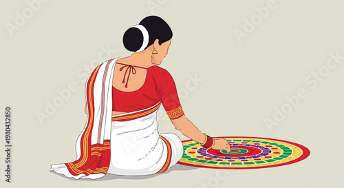 Woman creating traditional colorful rangoli design on floor with her hand, wearing a white saree with red border.
