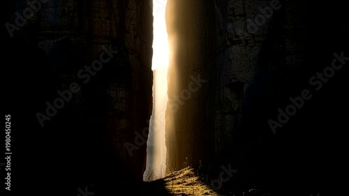 Sunlight Streaming Through Curtain in Dark Room.