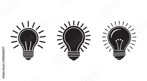 Blackandwhite light bulb icons withrays on white background for business andcreativity concepts  symbols of ideas andinnovation