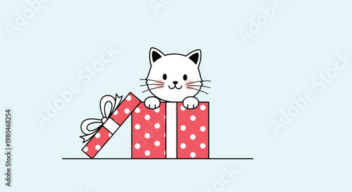 Cute white kitten sitting inside a red polka dot gift box with a white ribbon bow on a light blue background.