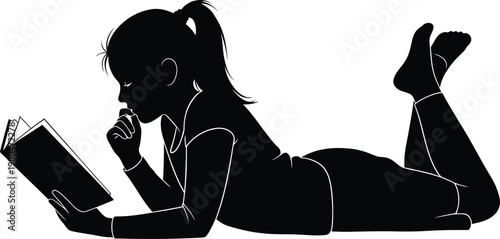 Silhouette of a young woman reading a book relaxing indoors