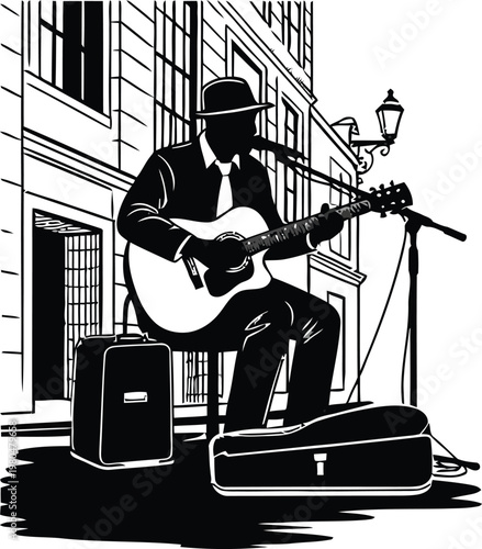 Silhouette of a street musician playing acoustic guitar in the city