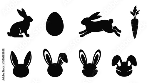 Black silhouettes of easter bunnies an egg and carrots on a white background