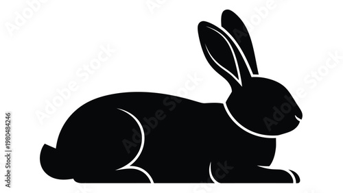 A minimalist silhouette of a rabbit in a resting prone position