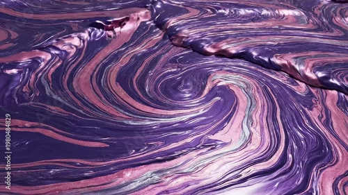 Close-up abstract swirl of purple and pink marbled paint with metallic sheen, fluid motion and glossy texture