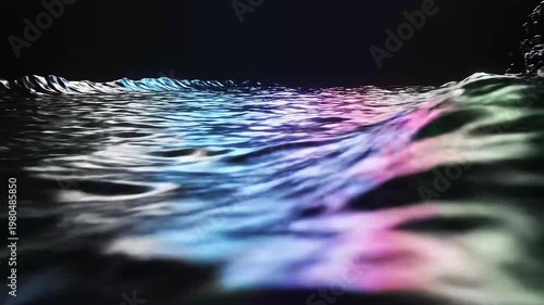 Abstract low-angle ocean wave with glossy surface reflecting pink and blue light against a black background