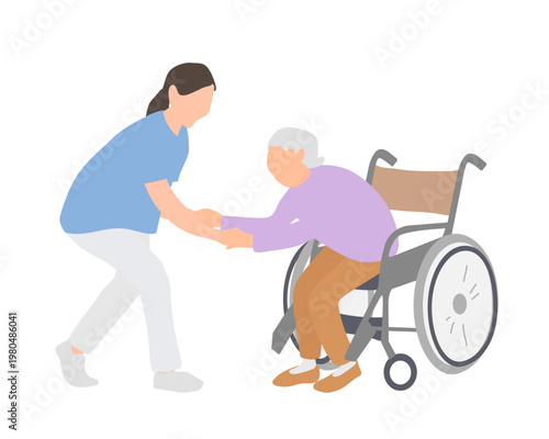 車椅子から立ち上がる高齢女性を支える介護スタッフ