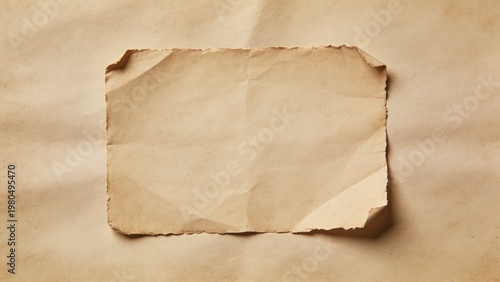 features a vintage-style, rectangular piece of paper with a sepia tone, giving it an aged appearance. The paper has slightly frayed and curled edges