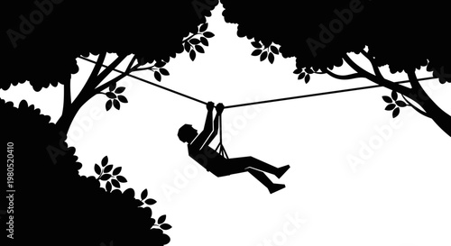 Silhouette of person on zipline.