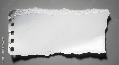 Torn Paper Fragment: A close-up shot of a ripped piece of white paper, showing the textured edge and remnants of the spiral binding, suggesting a story left untold.
