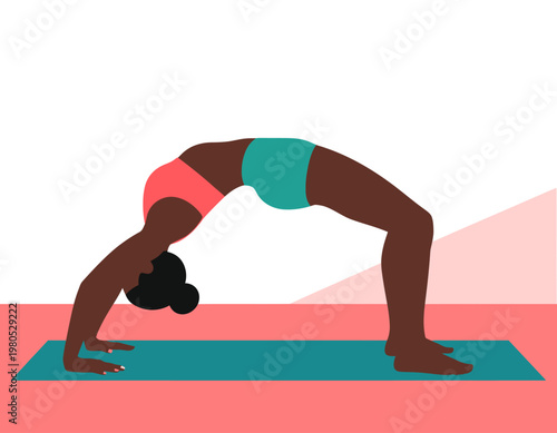 A dark-skinned woman in a pink sports bra and teal shorts performs the challenging wheel yoga pose on a mat.